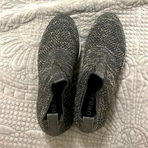 Black and gold tennis shoes